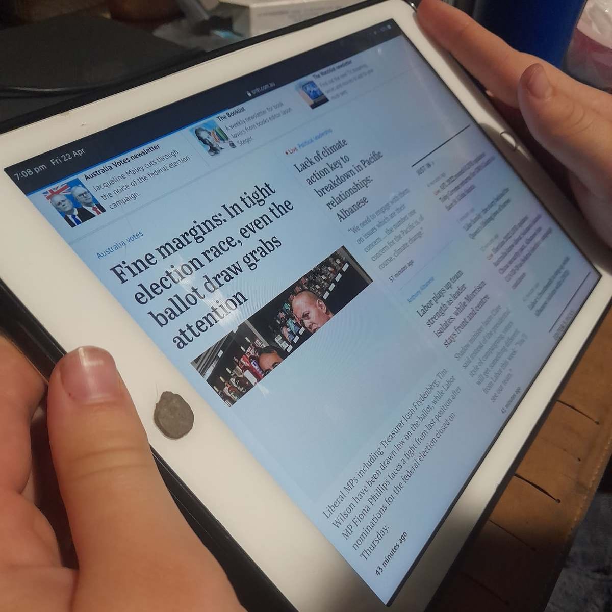 A news website displayed on an iPad