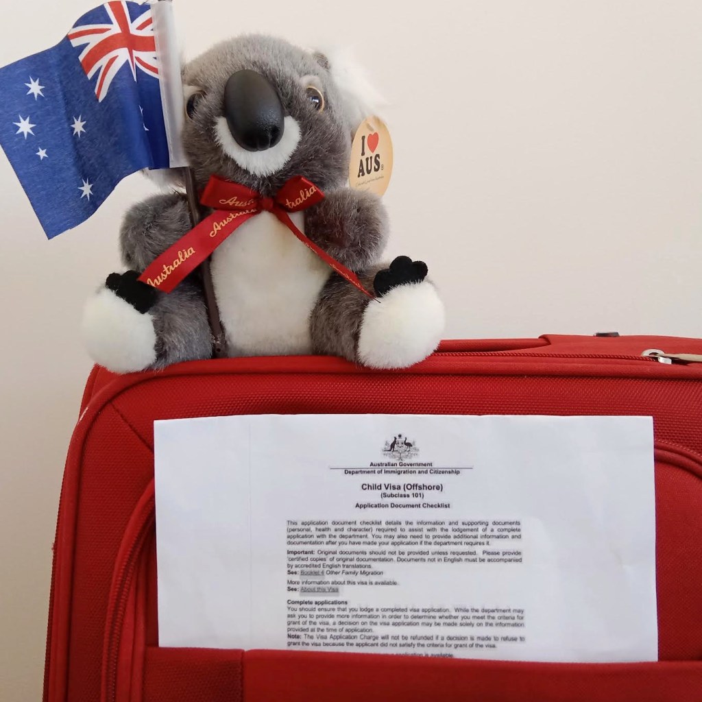 Child visa application and koala on suitcase 