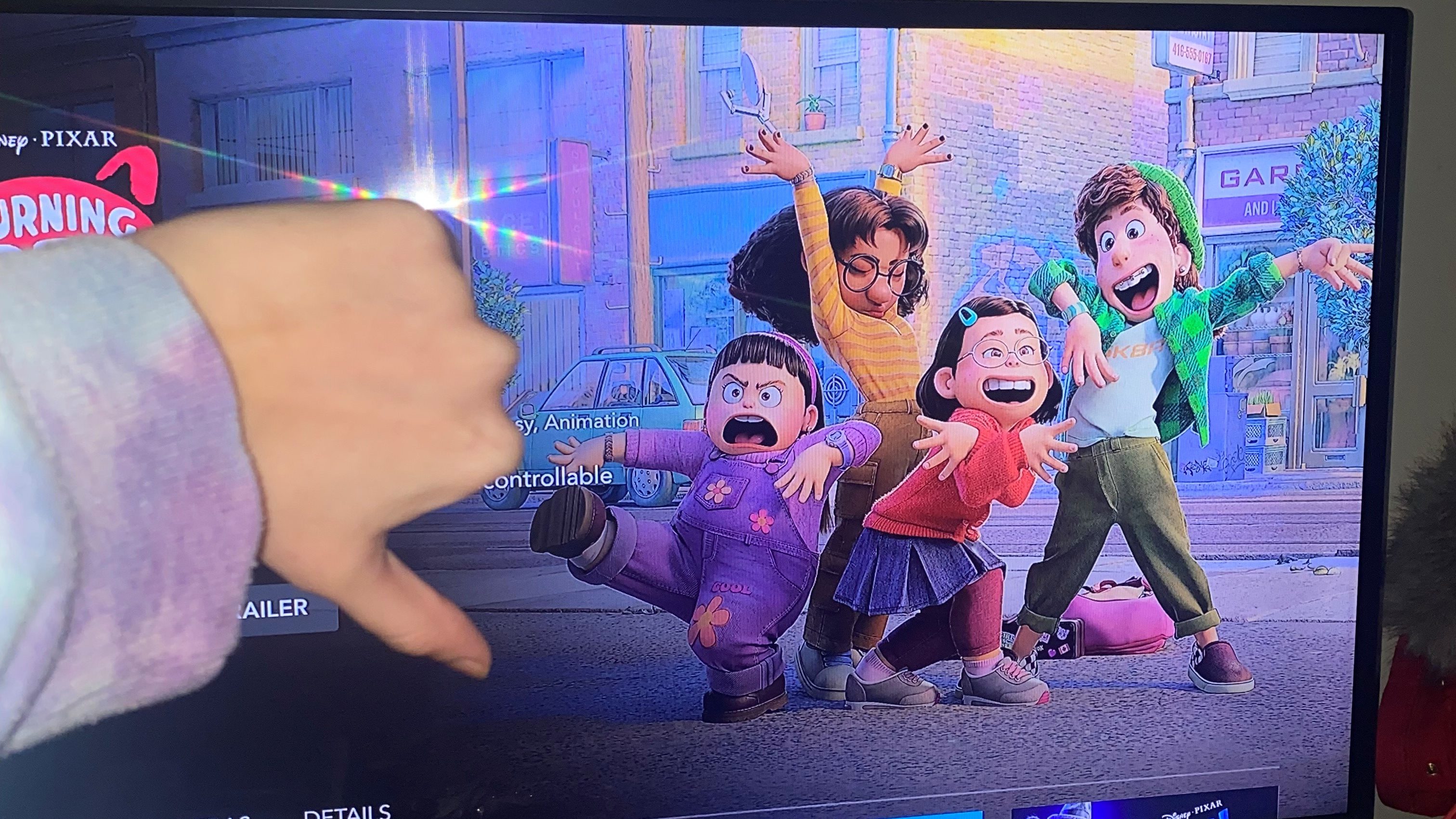 Turning Red preview on Disney Plus. Author Cara Ginnan showing the film a 'thumbs down' gesture.