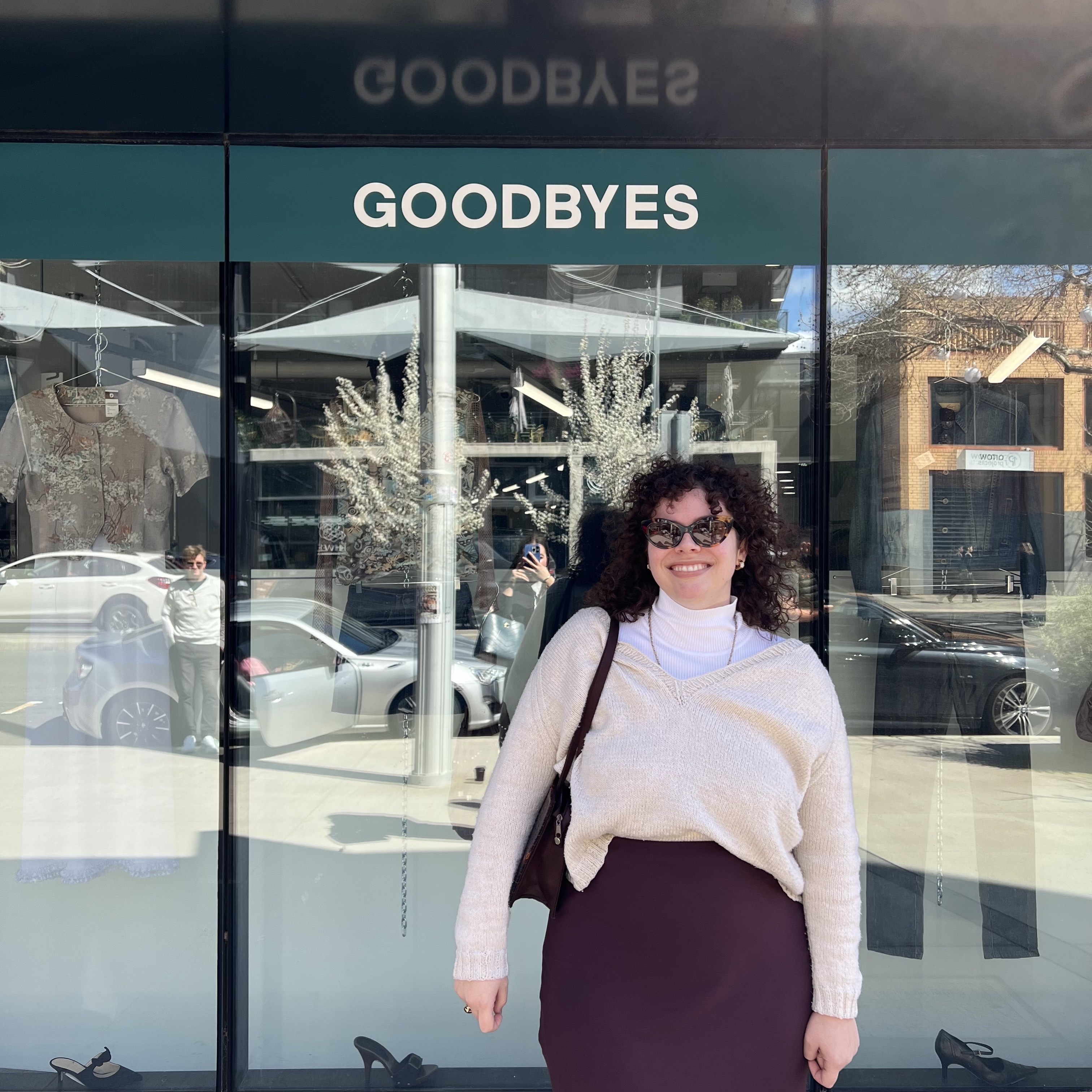 Claudia Tétreault-Percy standing in front of the Goodbyes shopfront window.