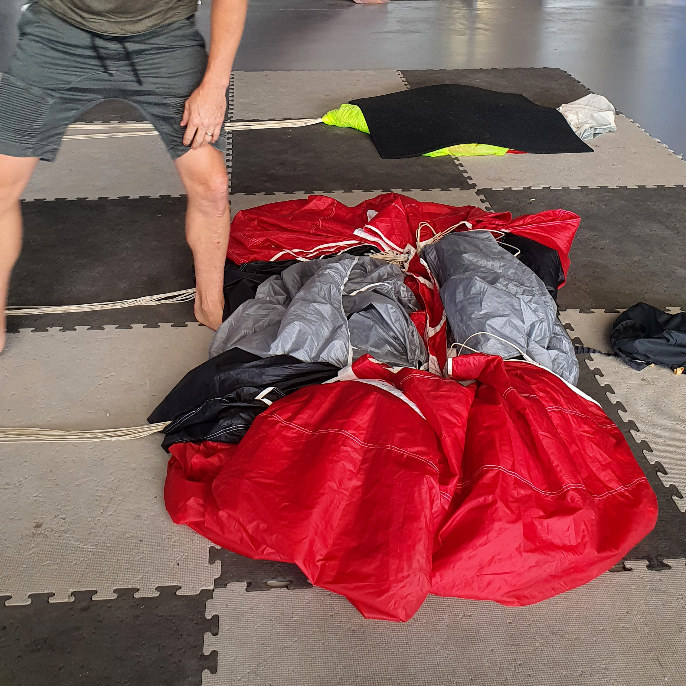 Ayjay's red parachute on the ground mid packjob.