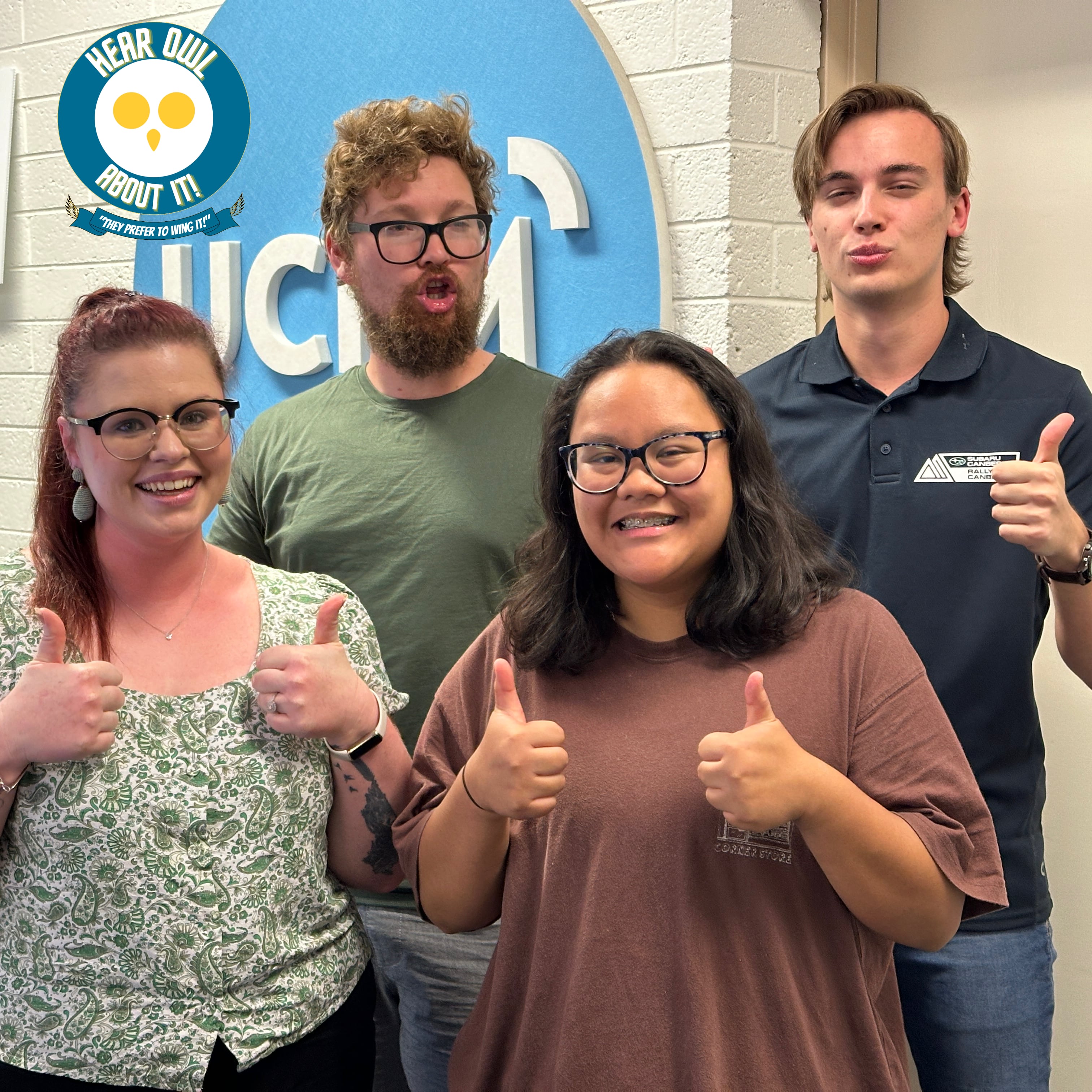 Lila, Josh, AJ and Zac posing in the UCFM with their best Donald Trump impersonations