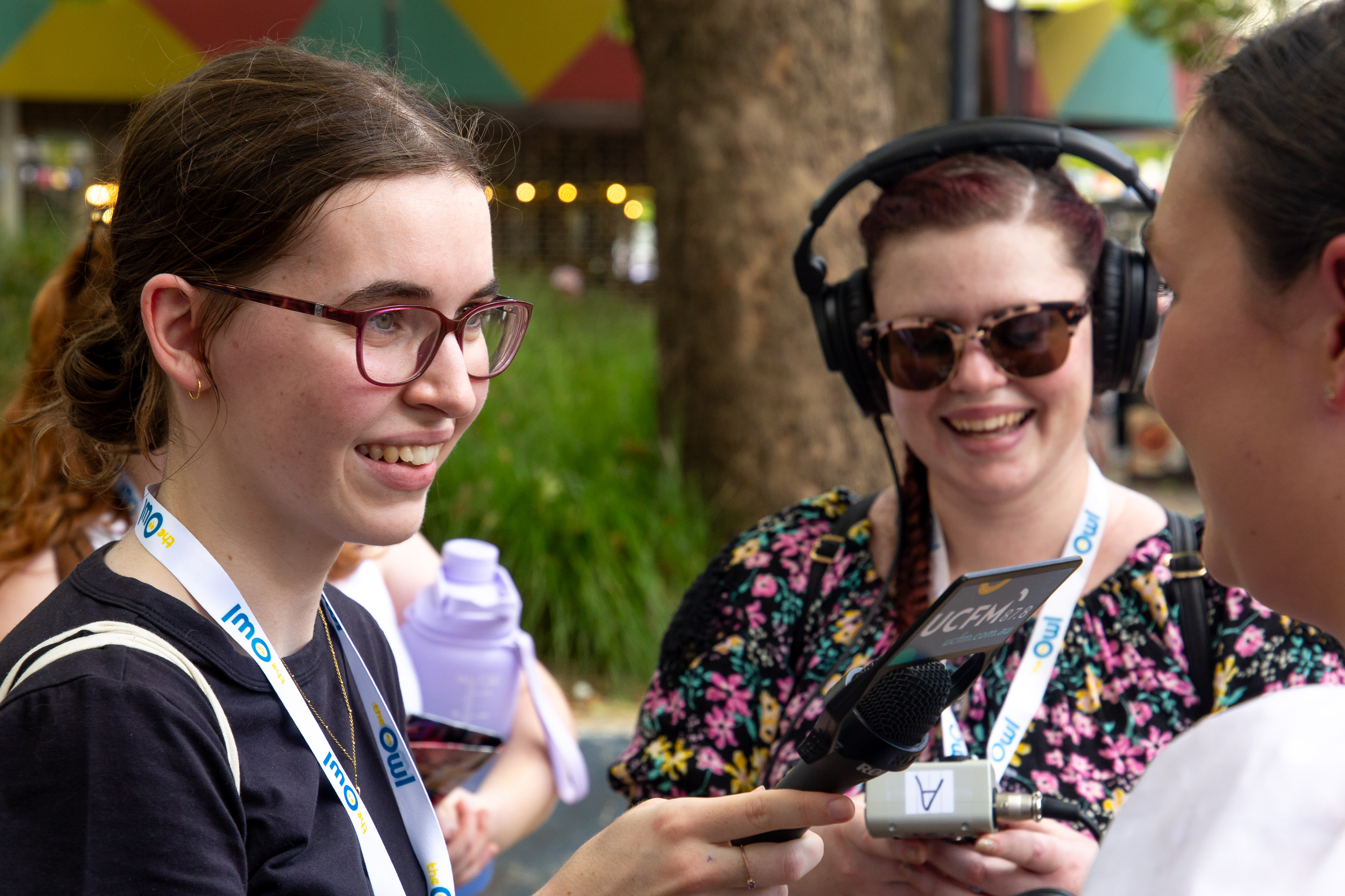 Tia and Lila interviewing a stallholder
