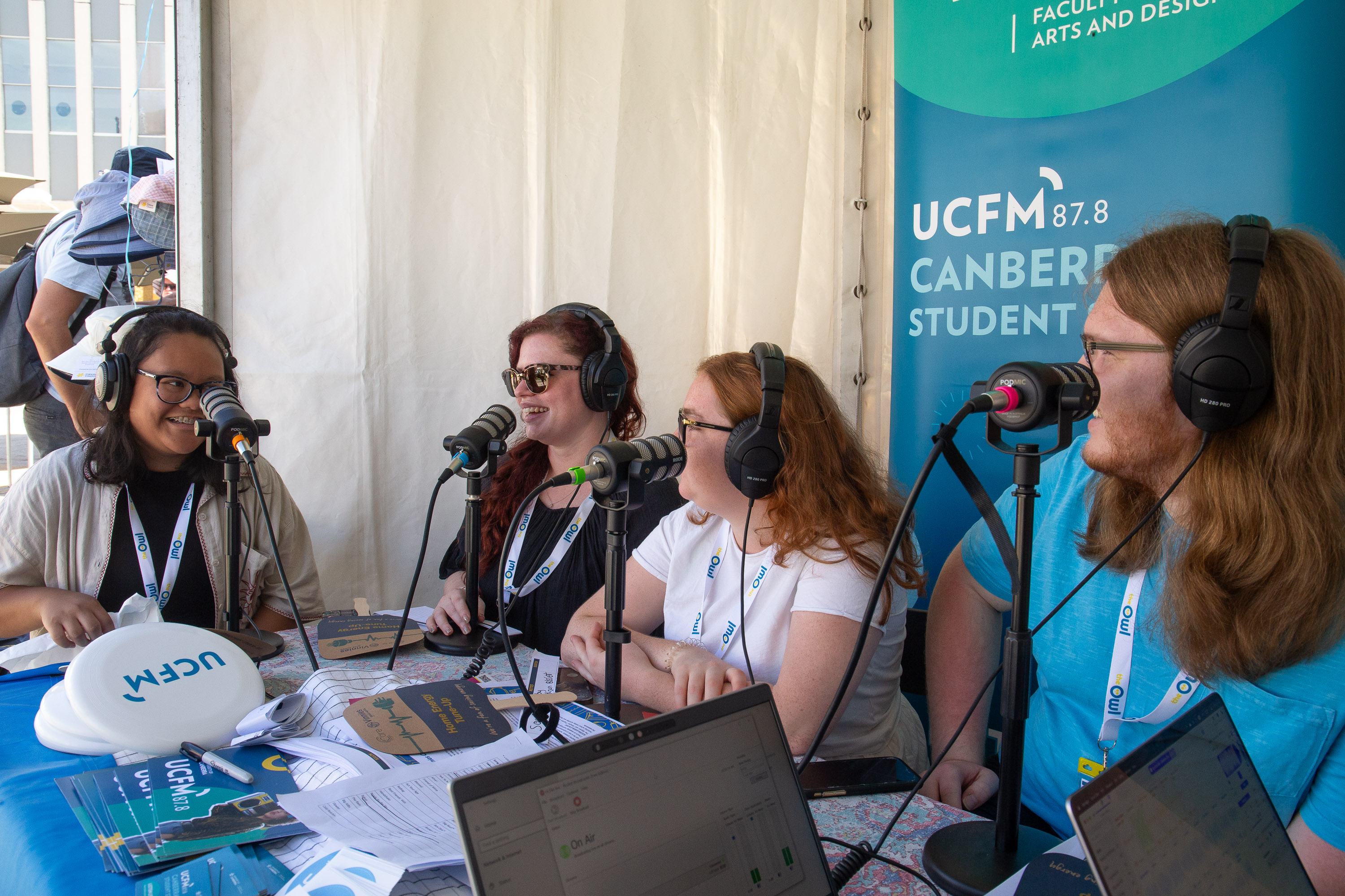AJ, Lila, Molly and Ben behind the mics at The Owl stall