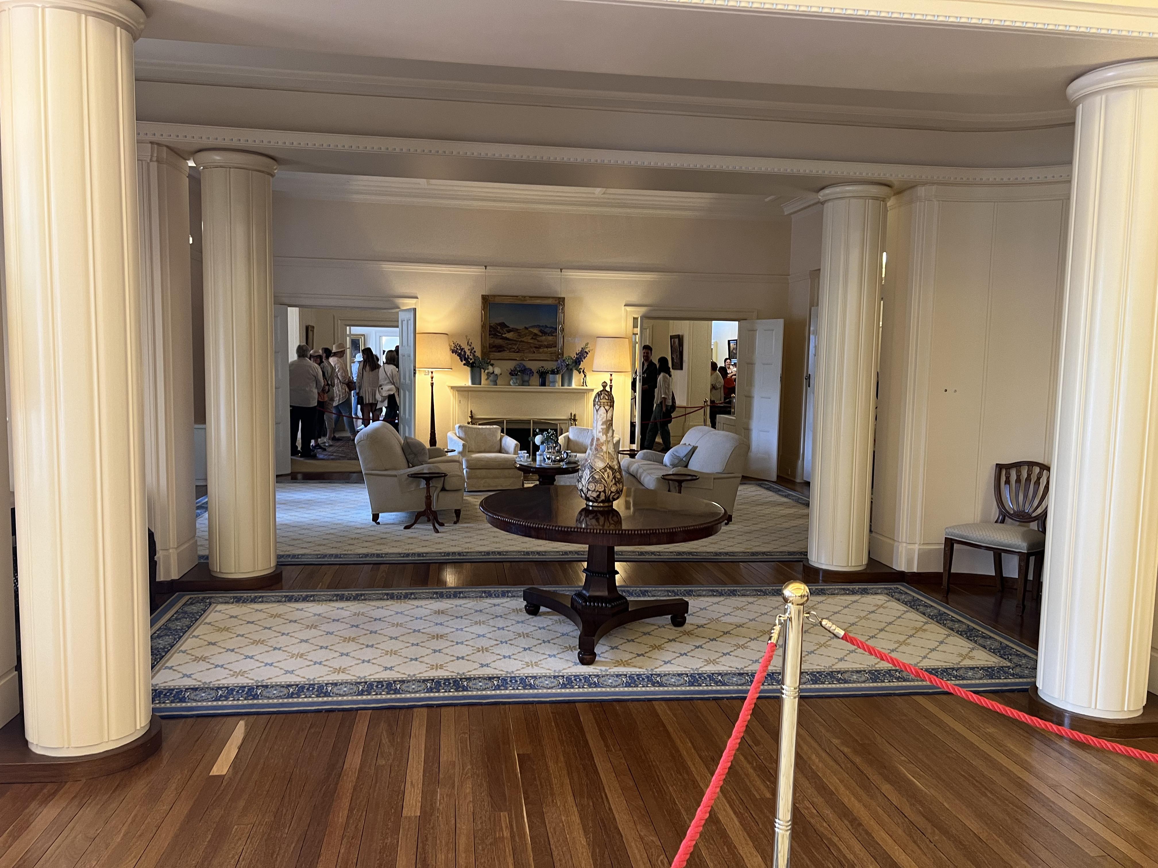Long view of the different sitting rooms and main room. 