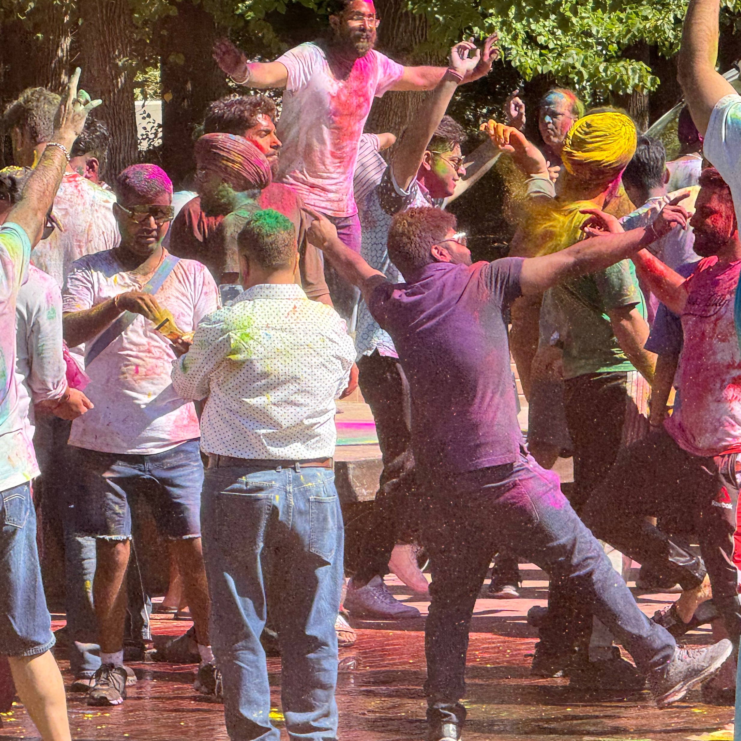 people dancing in red water