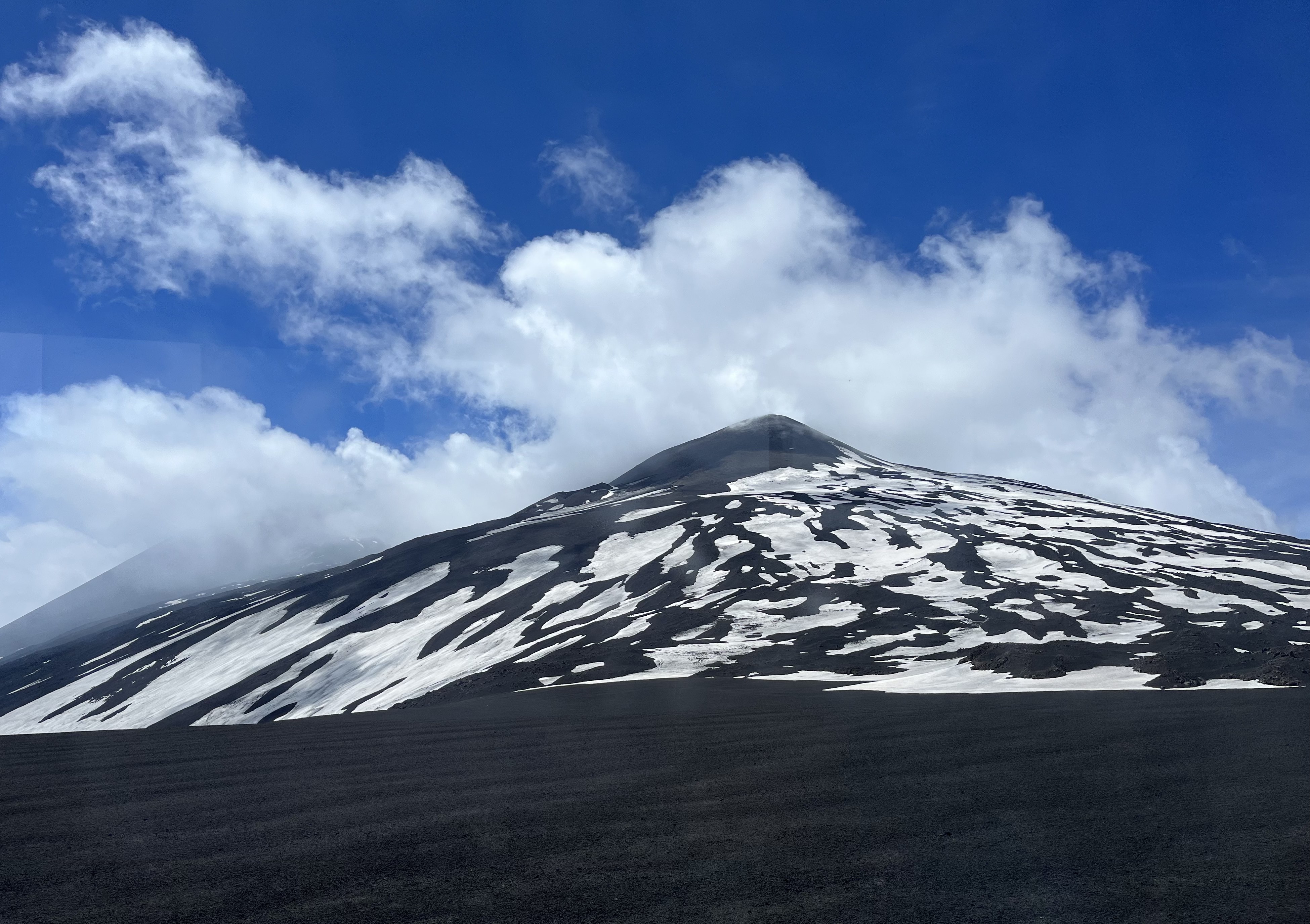Huge mountain with snow on it.