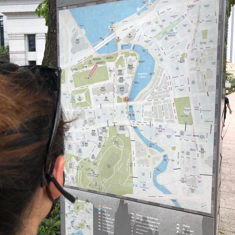 a girl looking at a map