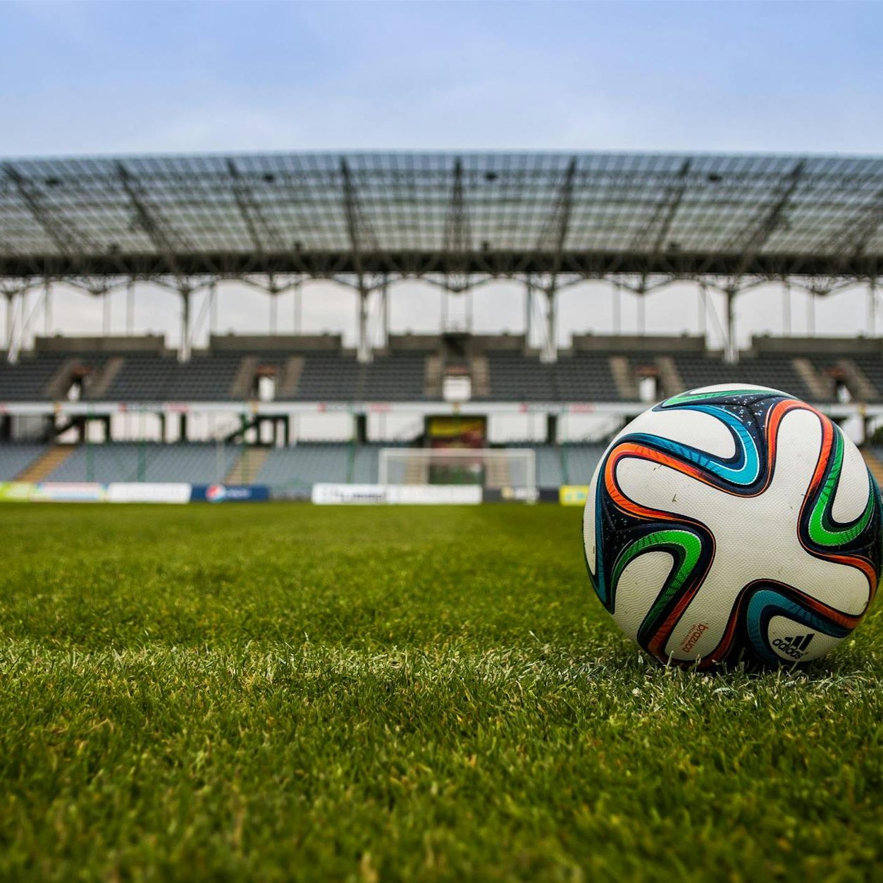 A football in the middle of a stadium.