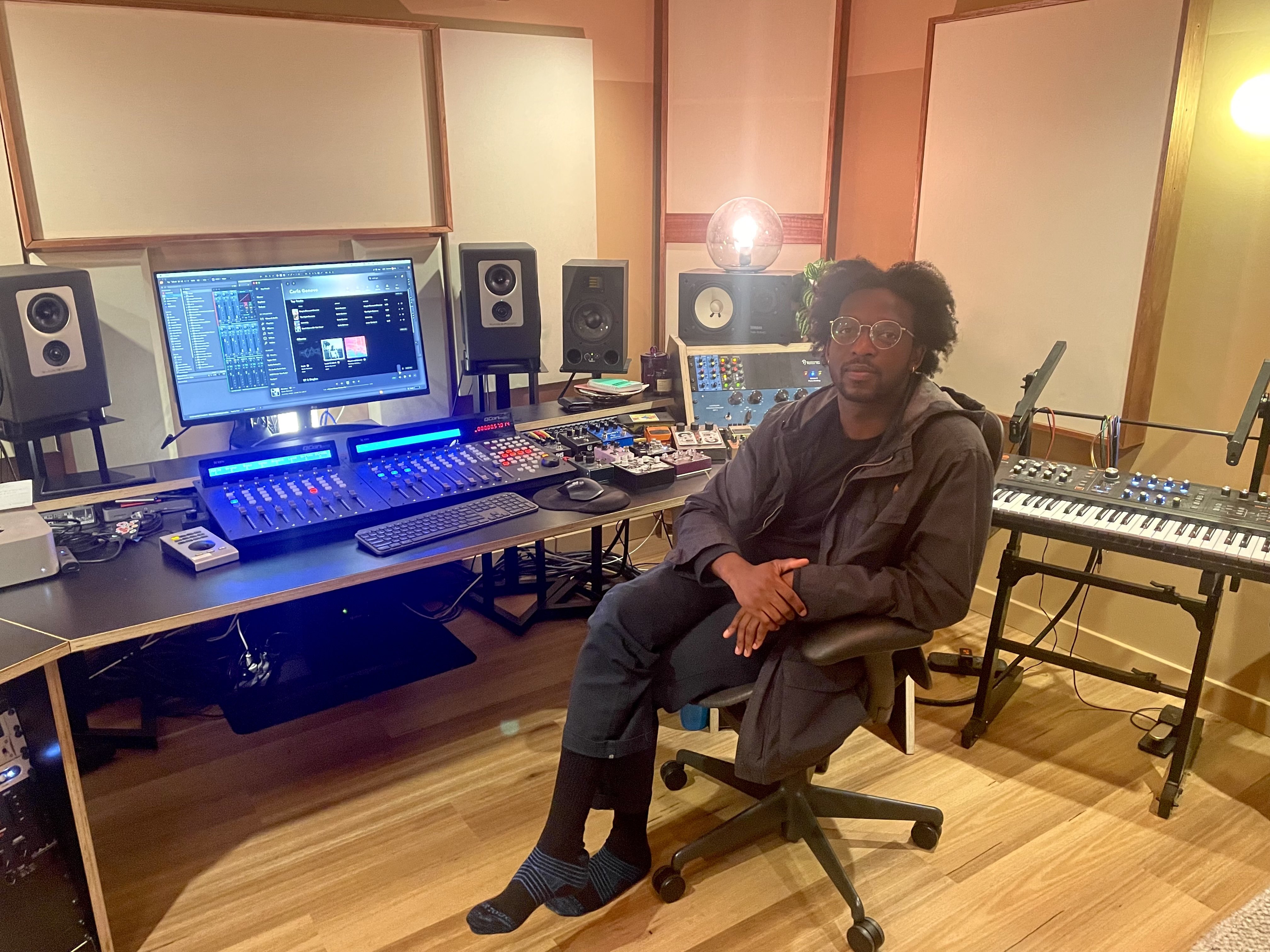 Man sitting at a music recording desk