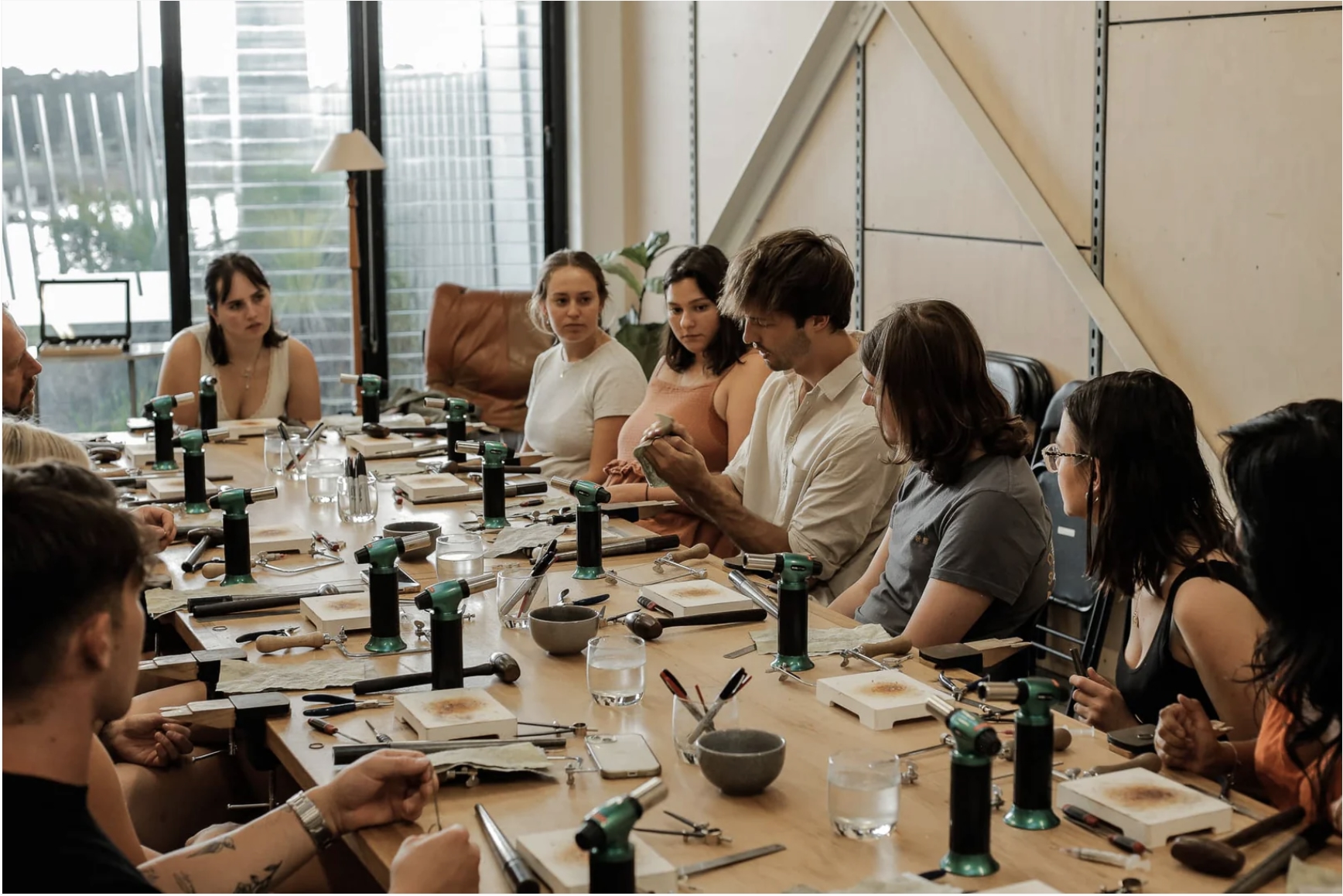 People sitting in a ring workshop class