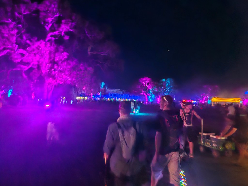 People walking through pitch