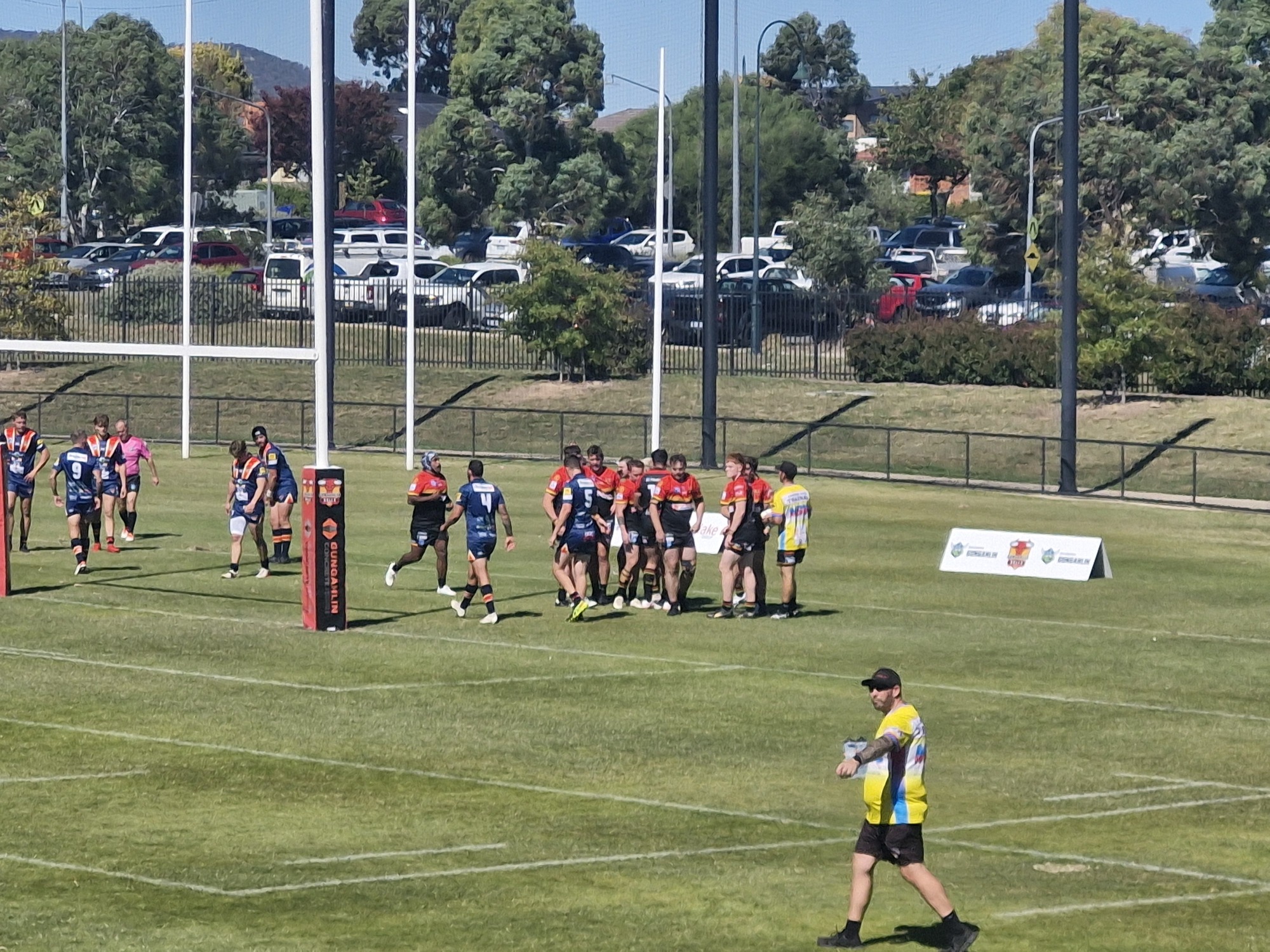 Bulls celebrate scoring a try by coming together under the posts