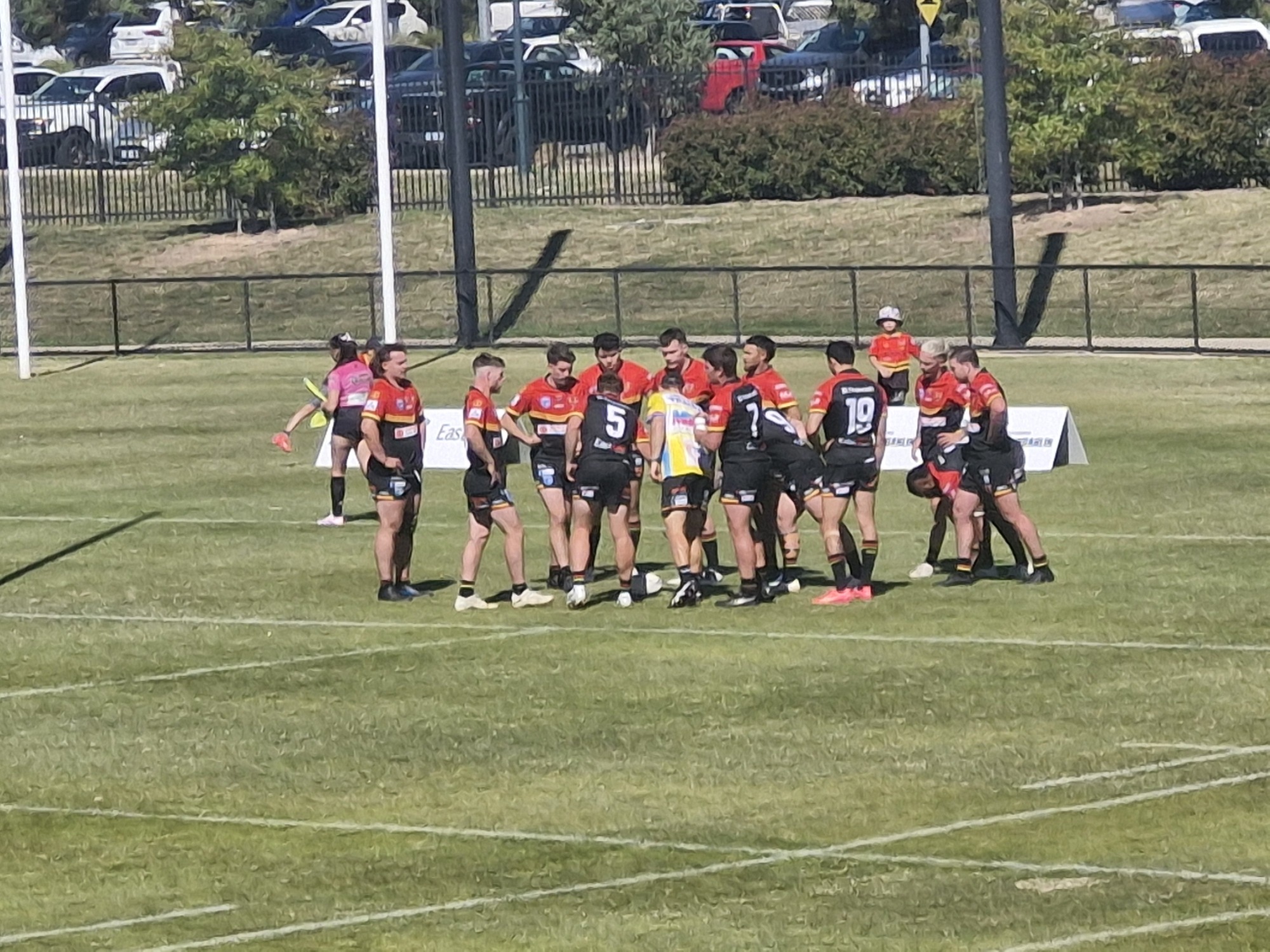 Gungahlin come together following a try being scored against them, discussing a game plan.