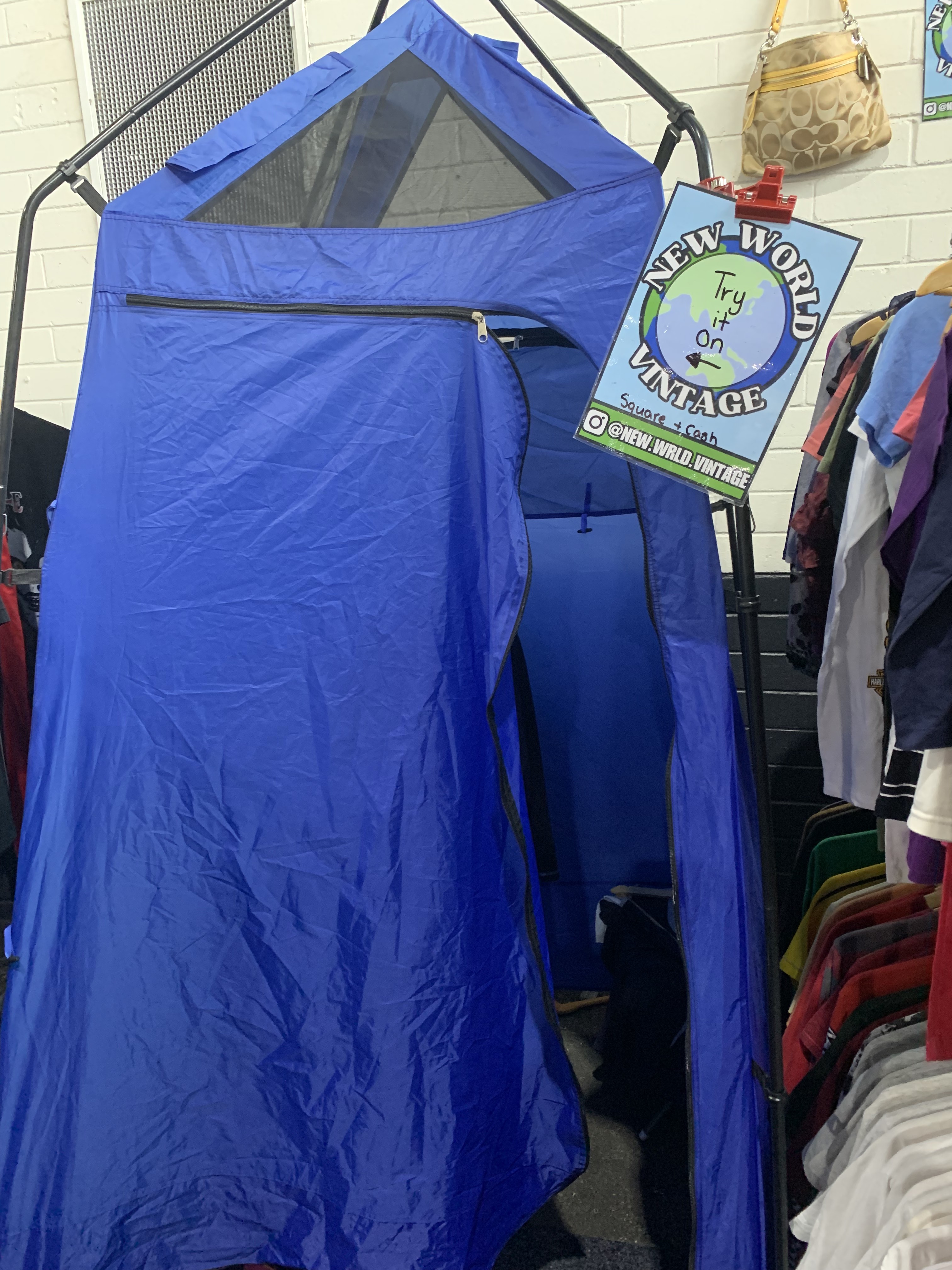 Large blue tent used as a changing room