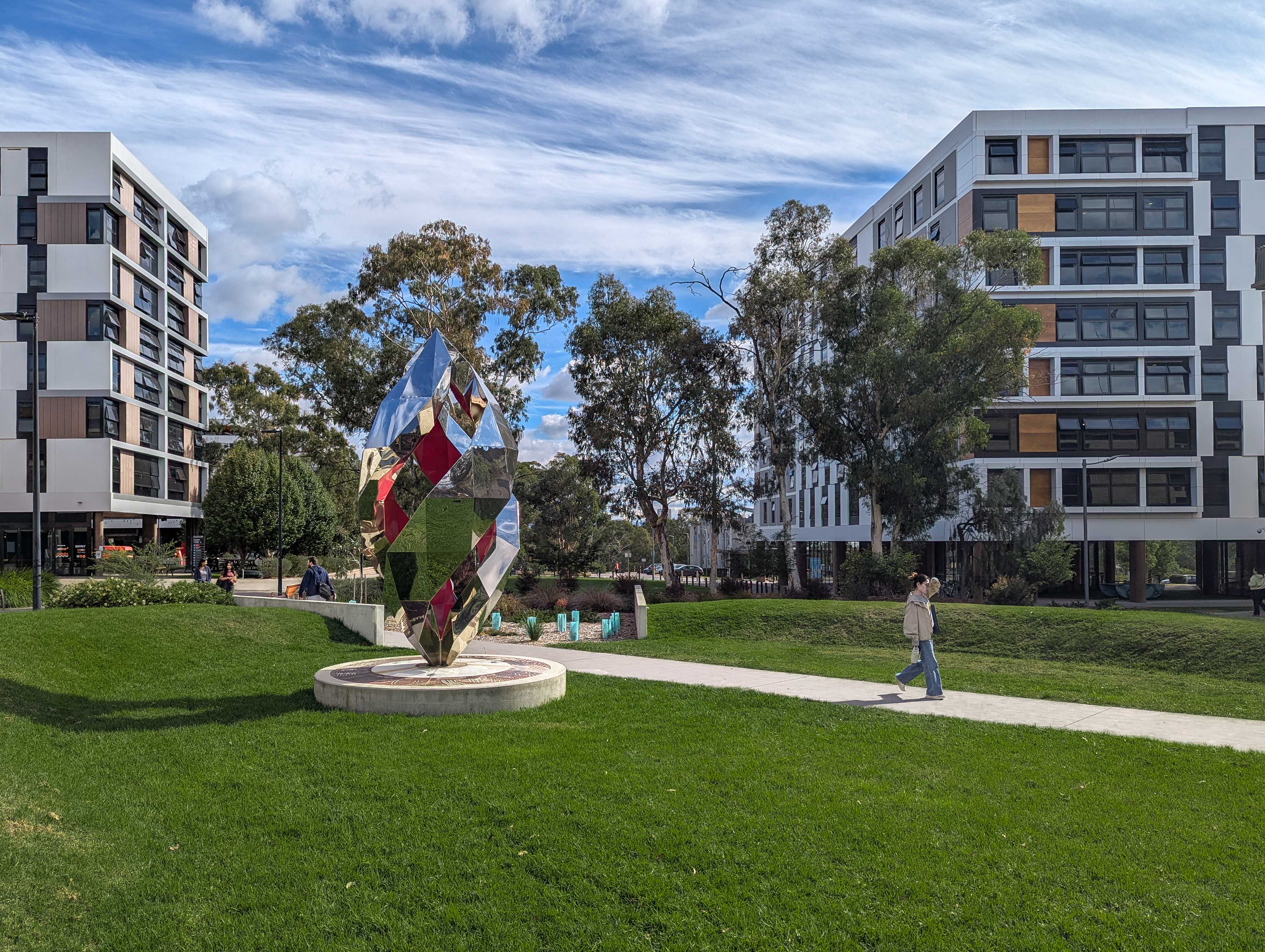 A photograph of the University of Canberra campus on a partly cloudy day