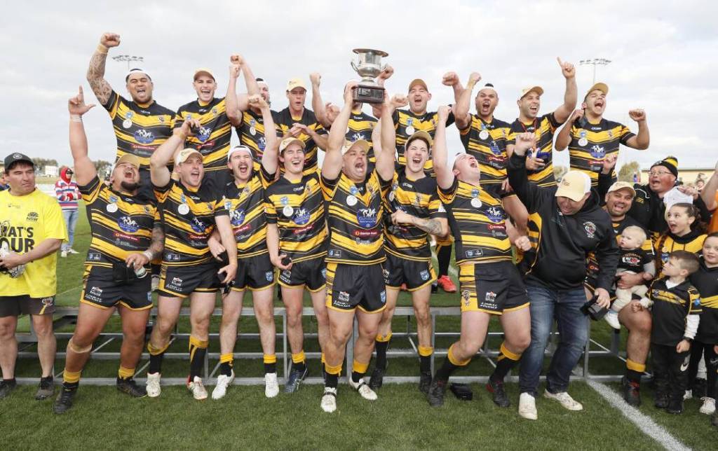 Club team photo of them cheering after winning and lifting the trophy