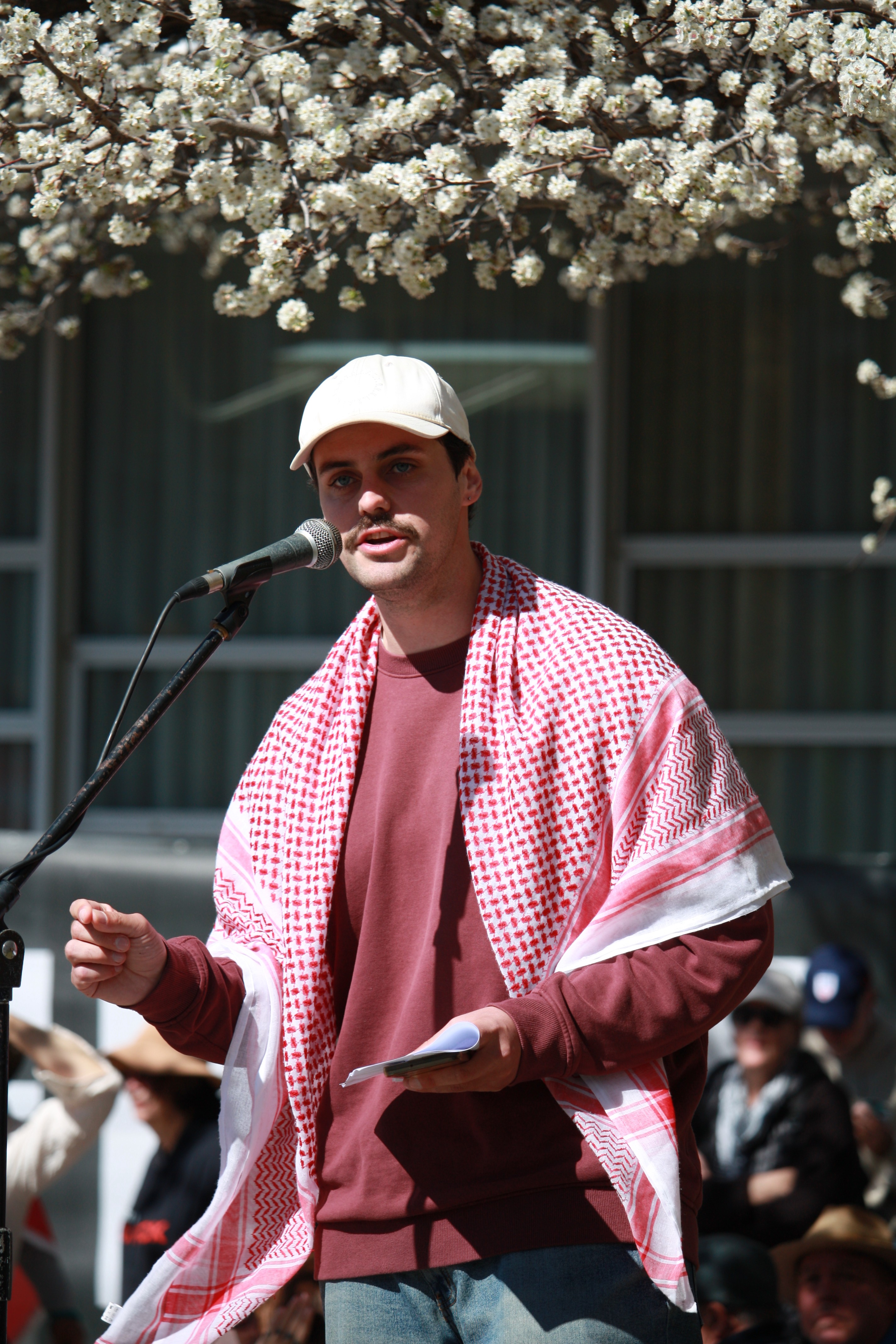 Palestine Action Group organiser Nick Reich giving a speech at the rally.