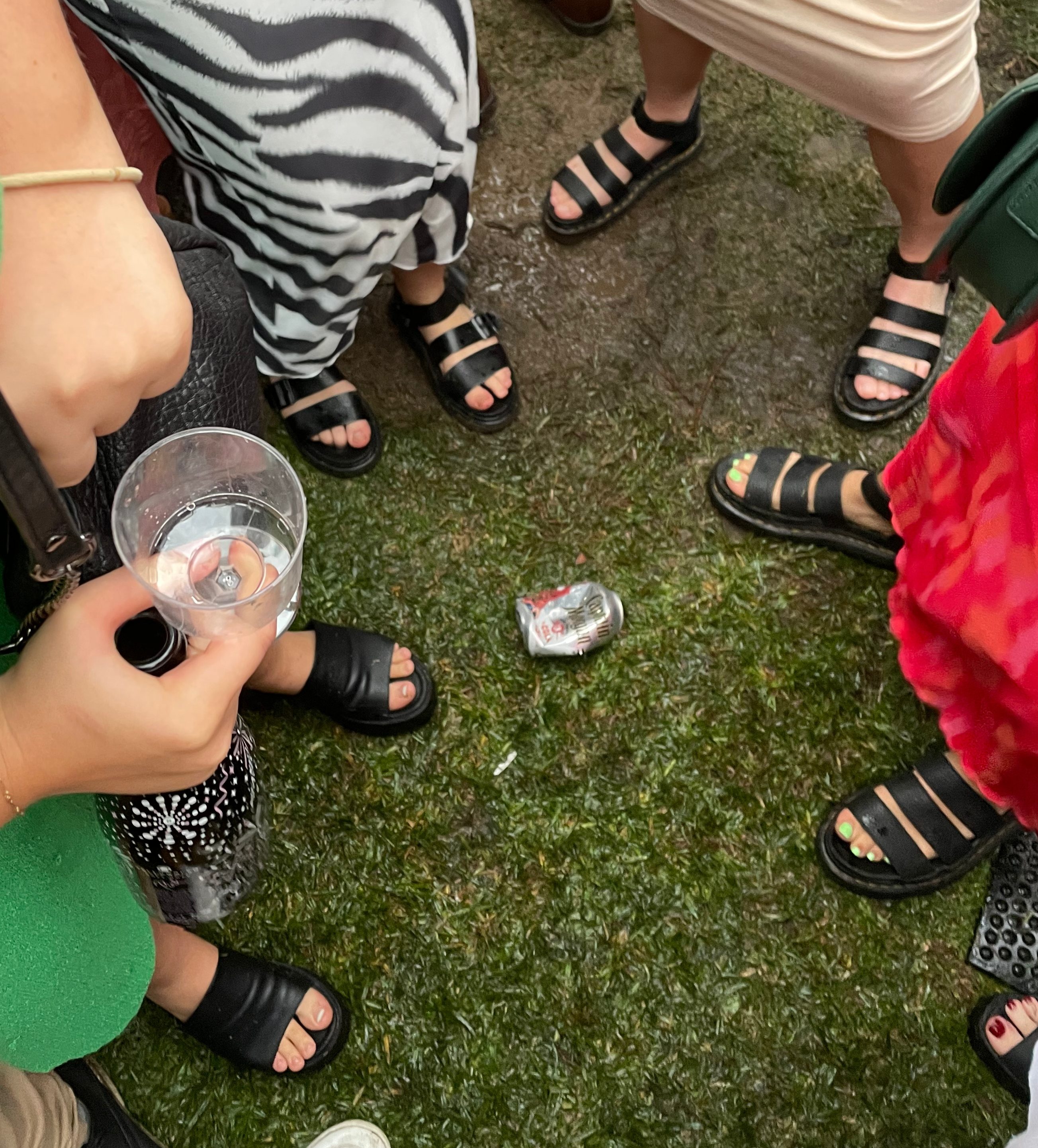 Photograph of several people all wearing the same style of shoe