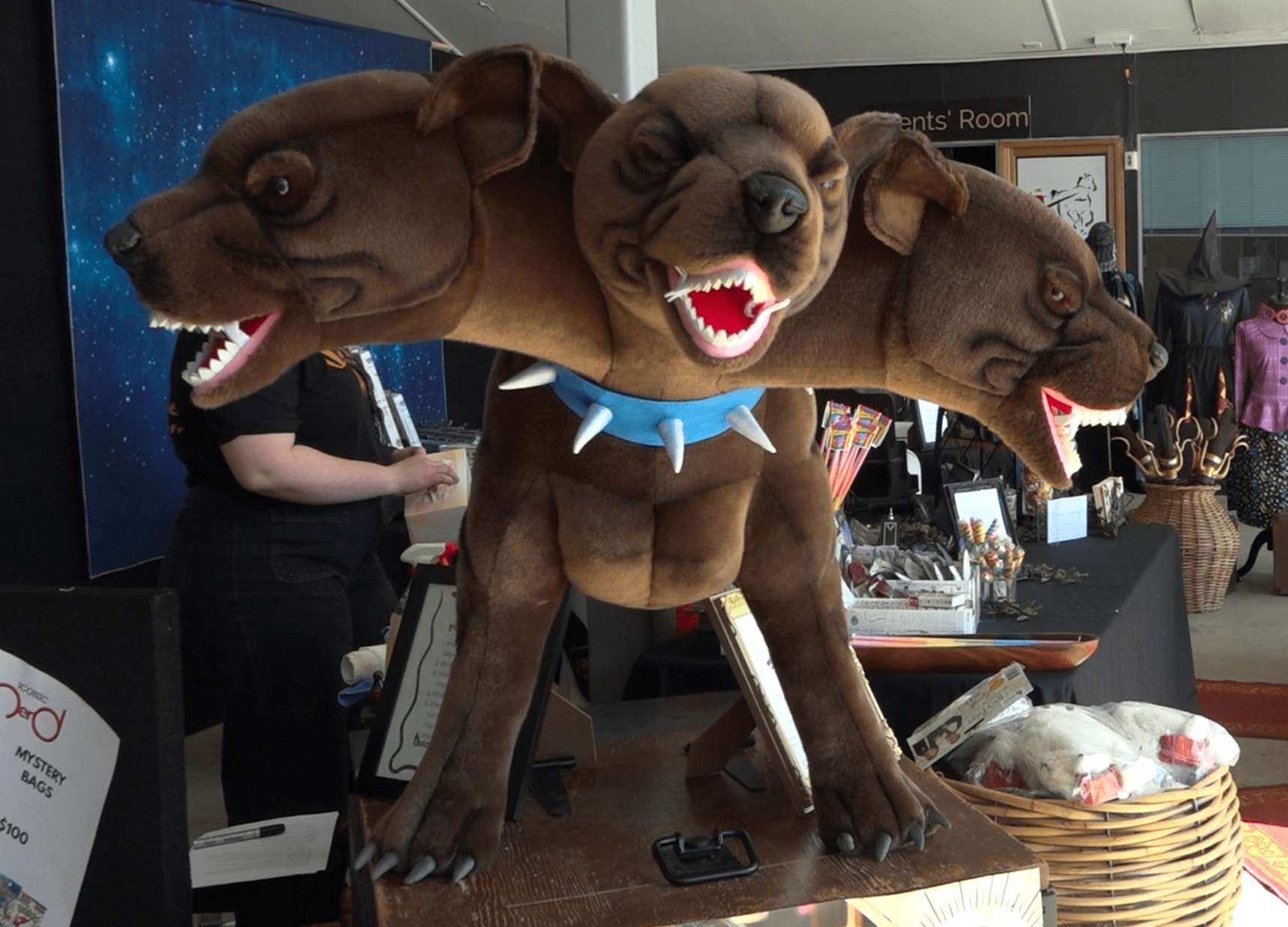 Statue of Fluffy the three headed dog from Harry Potter. Depicted with a blue spiked collar.