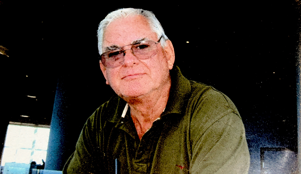 William (Bill) Ryan sat in a green shirt