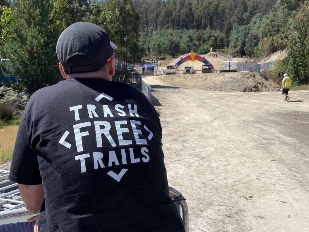 Co-founder Dan Smith wearing a Trash Free Trails T-Shirt at Red Bull Hardline Tasmania