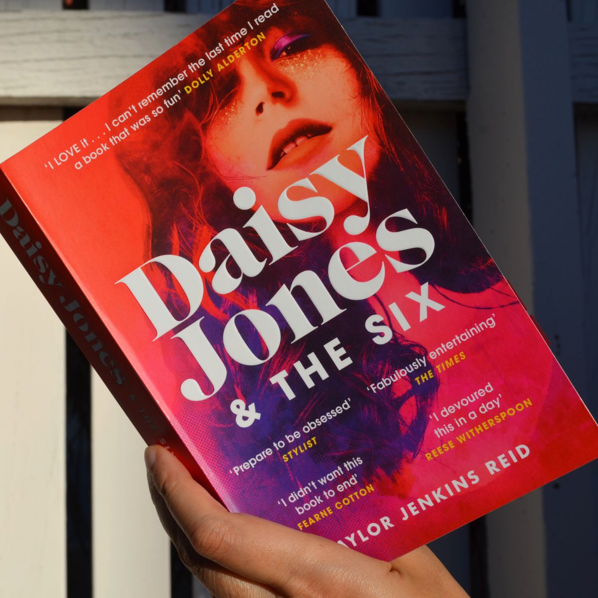 Reece’s Book Club pick 'Daisy Jones & The Six' being held, with the front cover showing.