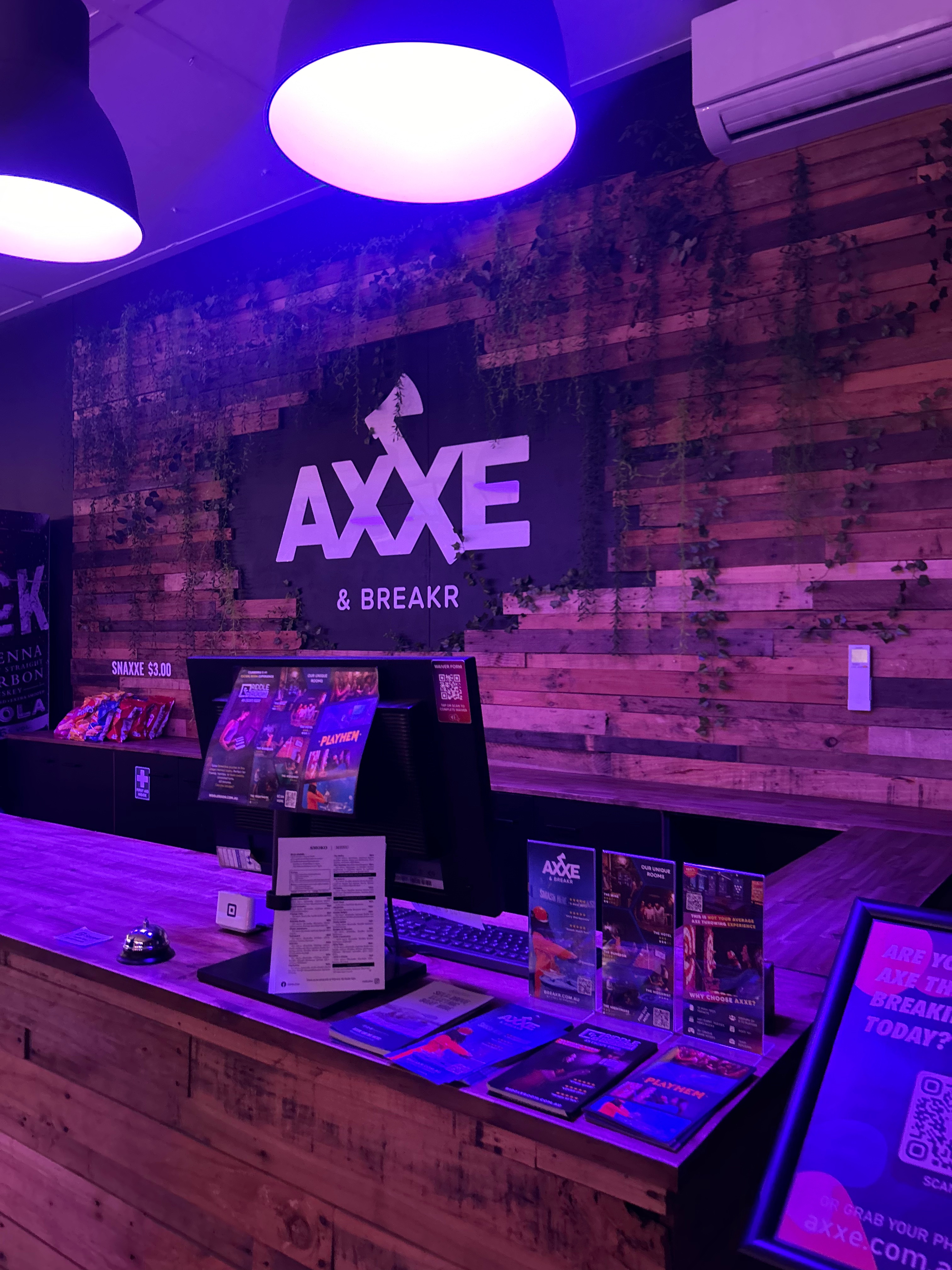 Front entrance of Breakr showing the counter and illuminatied interior