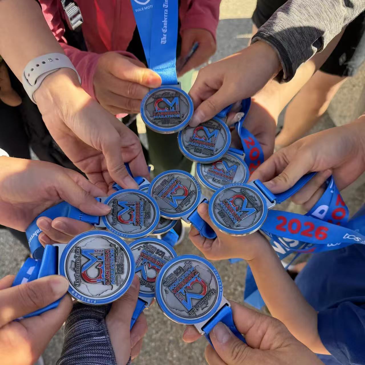 The medals of the ANU CTCC Running Group.