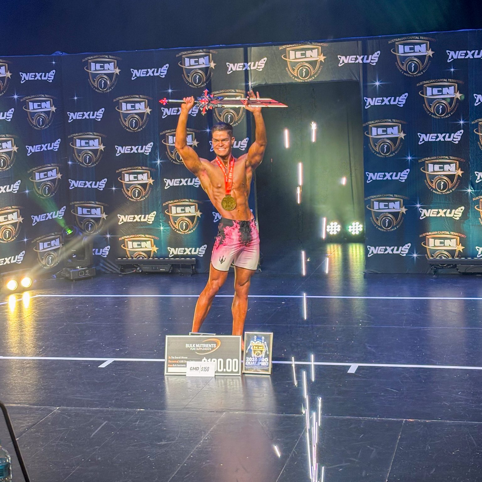 Josh Williams winning Men's Physique overall.
