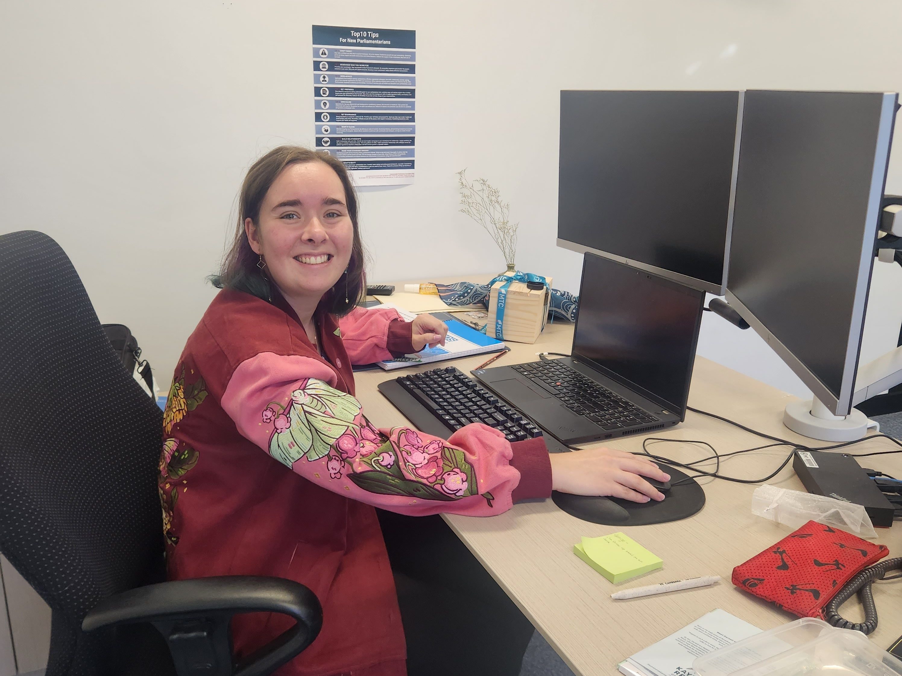 Politician Laura Nuttall sitting at her desk in her office at the ACT Legislative Assembly.
