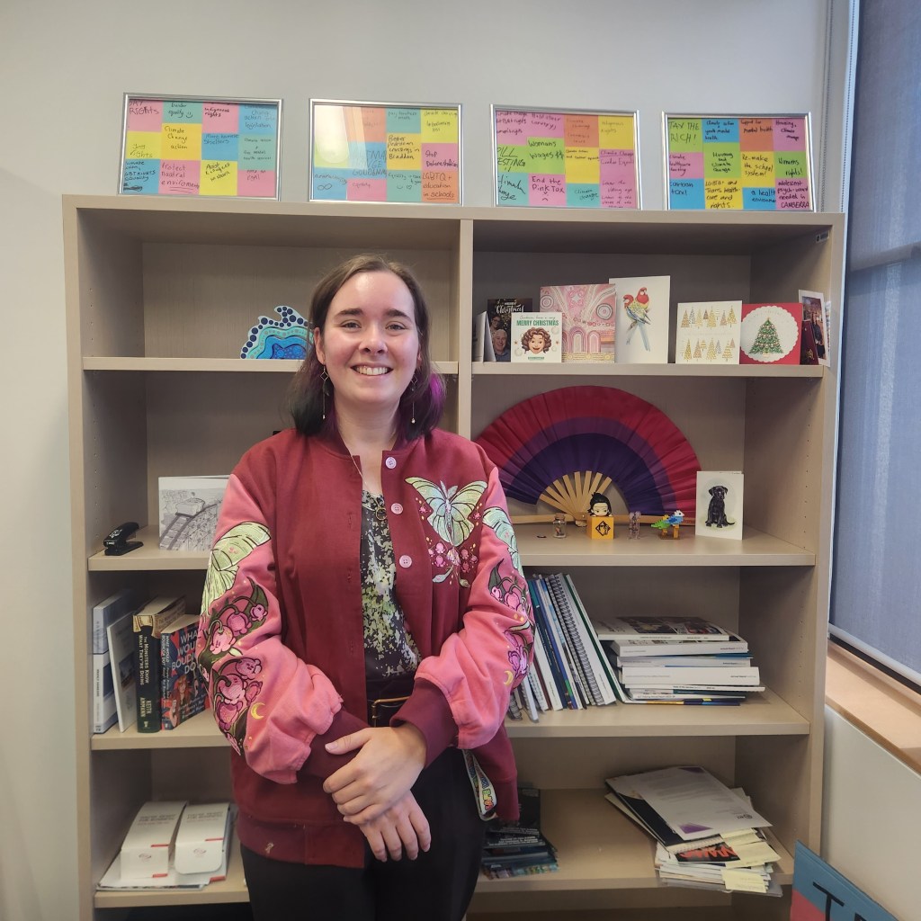 Politician Laura Nuttall standing in front of a shelf in her office at the ACT Legislative Assembly.